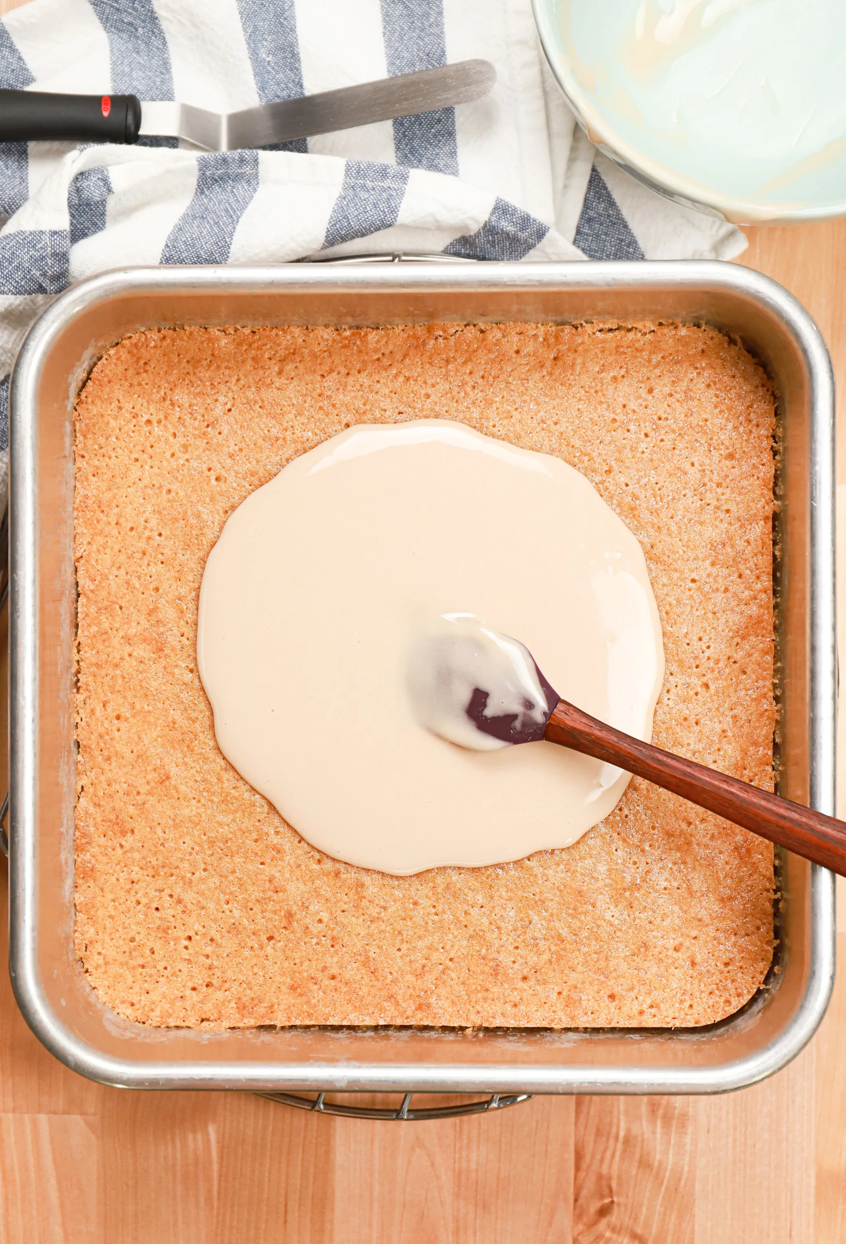 Overhead view of the maple glaze poured over the top of the maple blondie base.