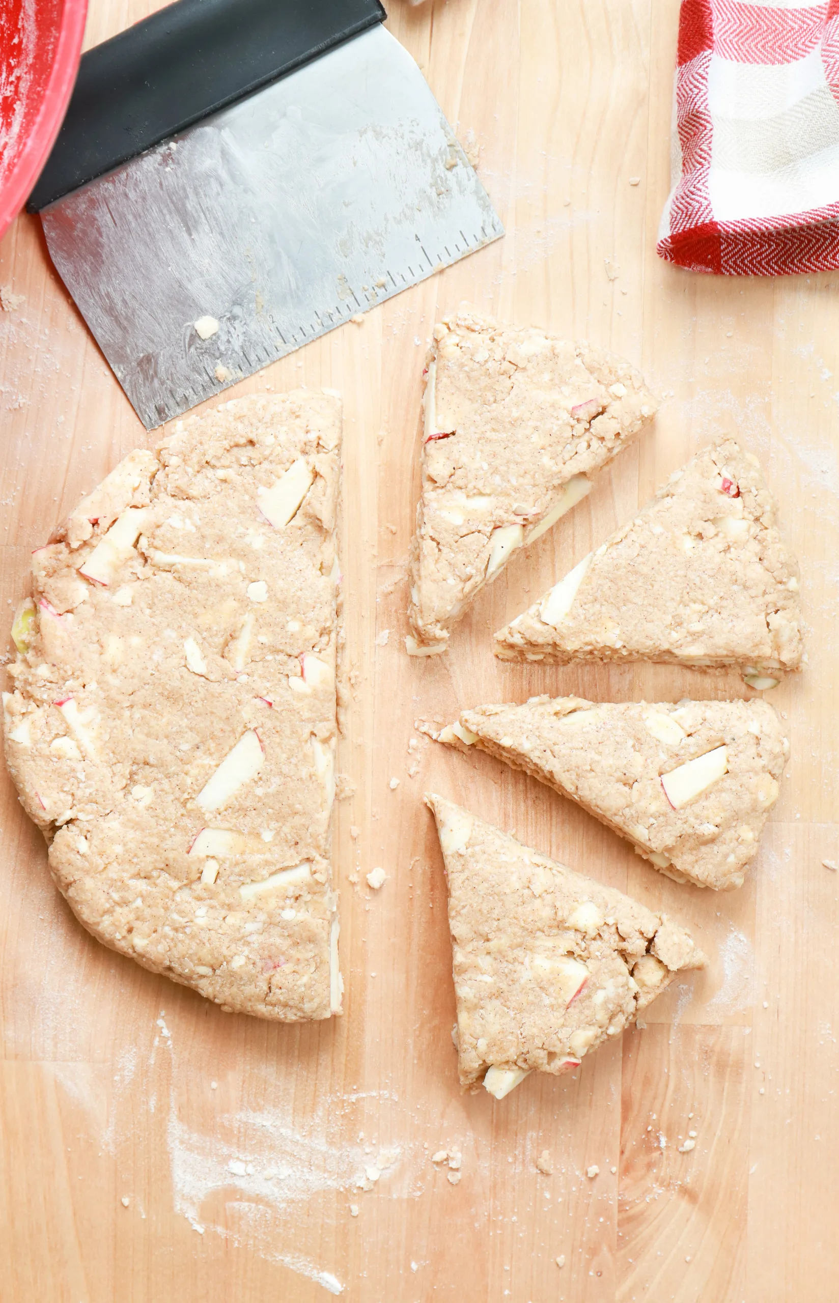 Overhead view of the apple cinnamon scone dough cut into pieces.