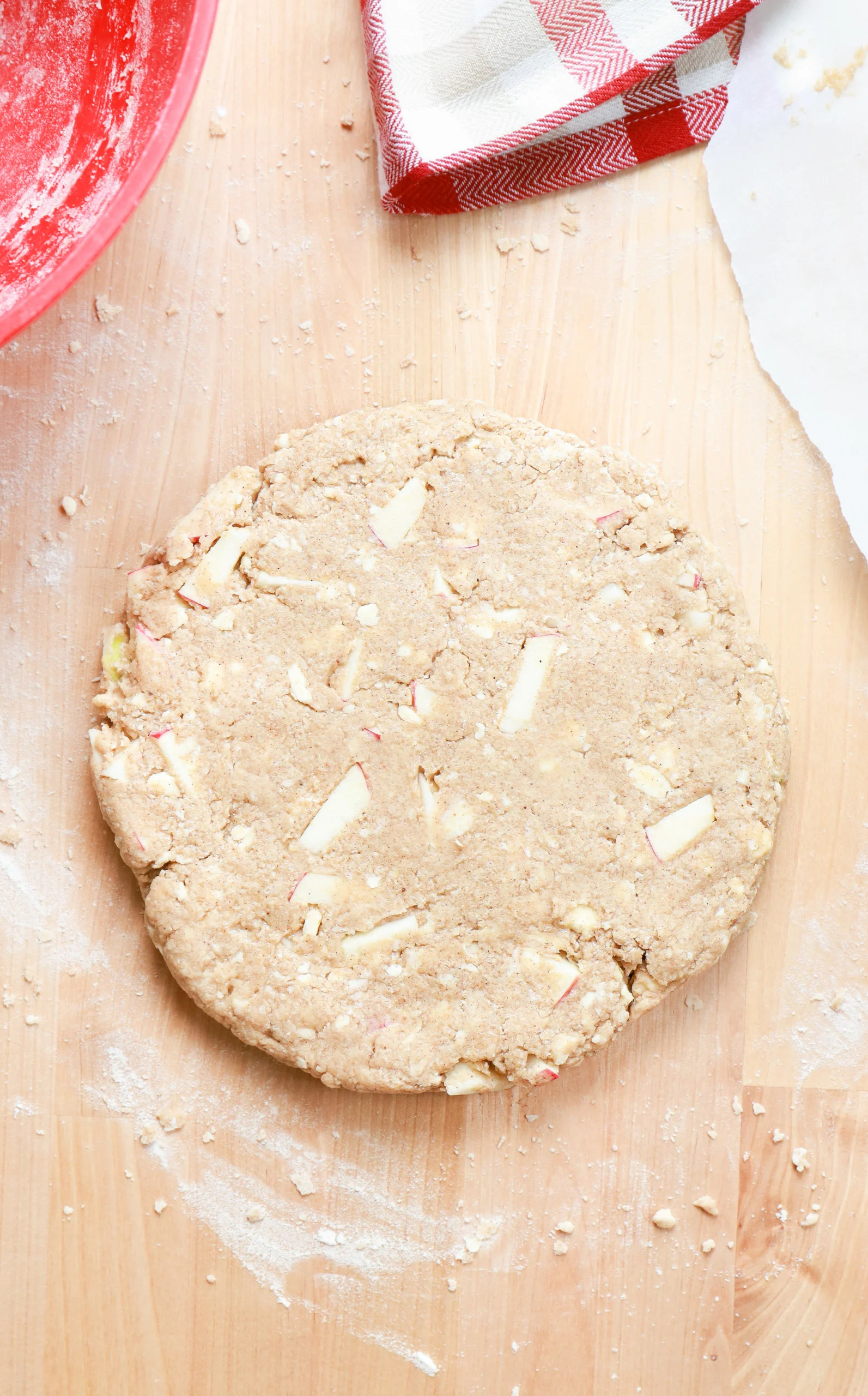 Overhead view of the apple cinnamon scone dough shaped into an eight inch circle.