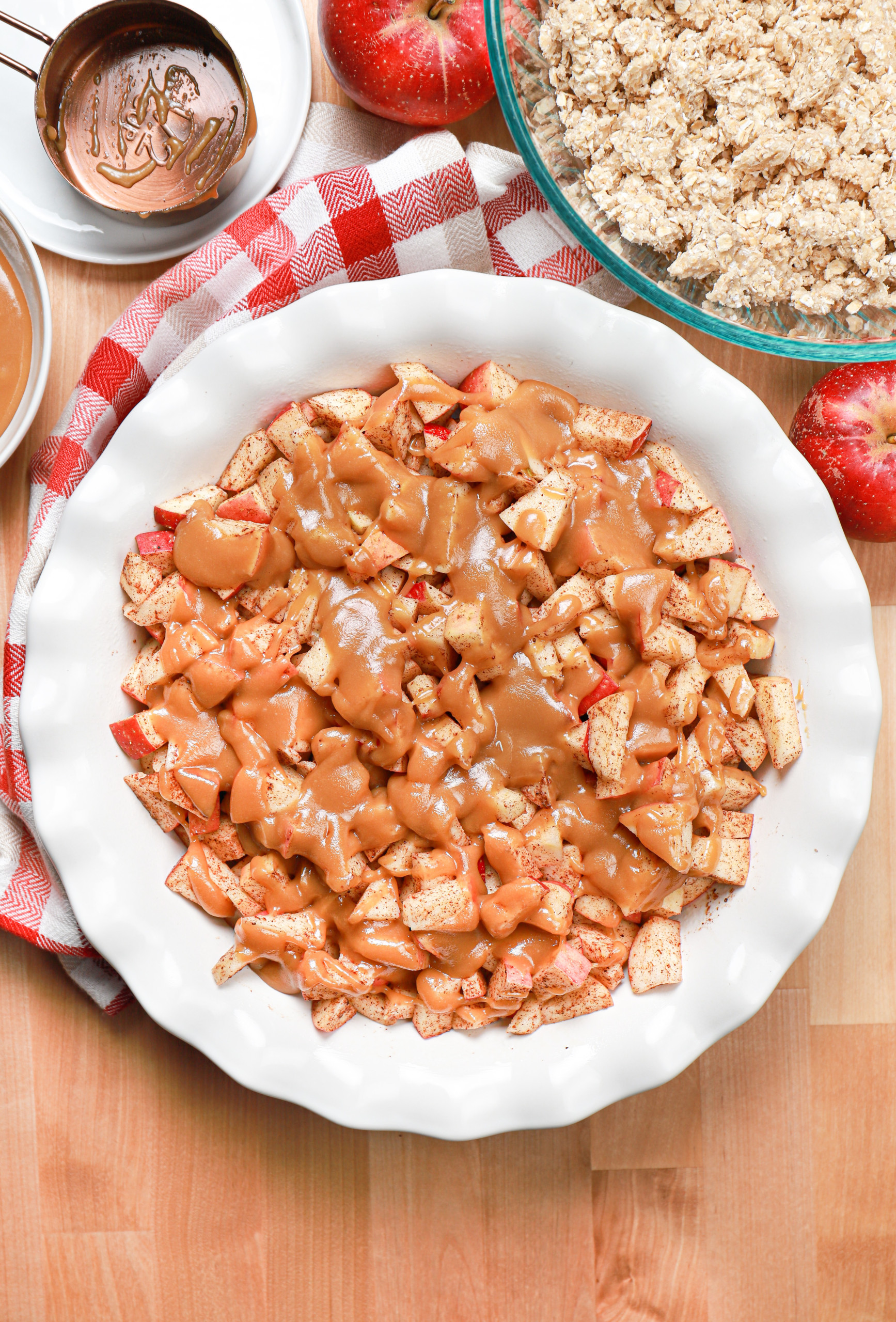 Overhead view of the caramel apple crisp before the streusel topping is sprinkled on top.