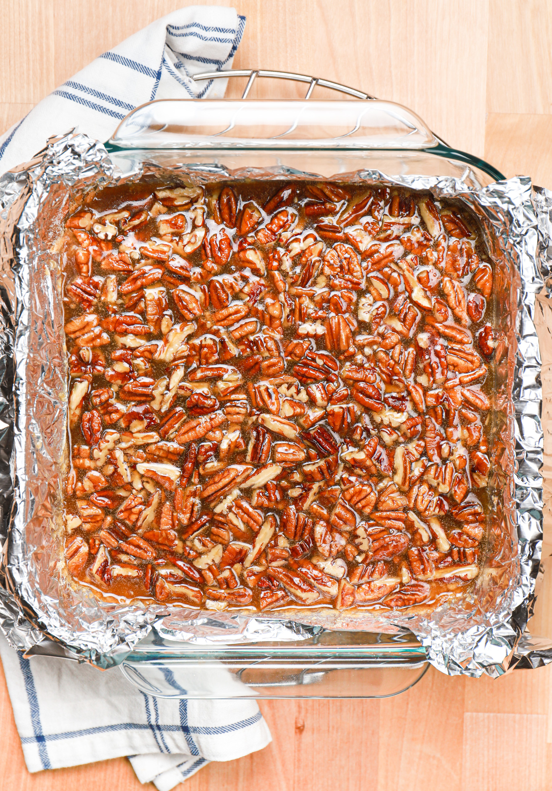 Overhead view of a batch of maple pecan pie bars before they are baked.