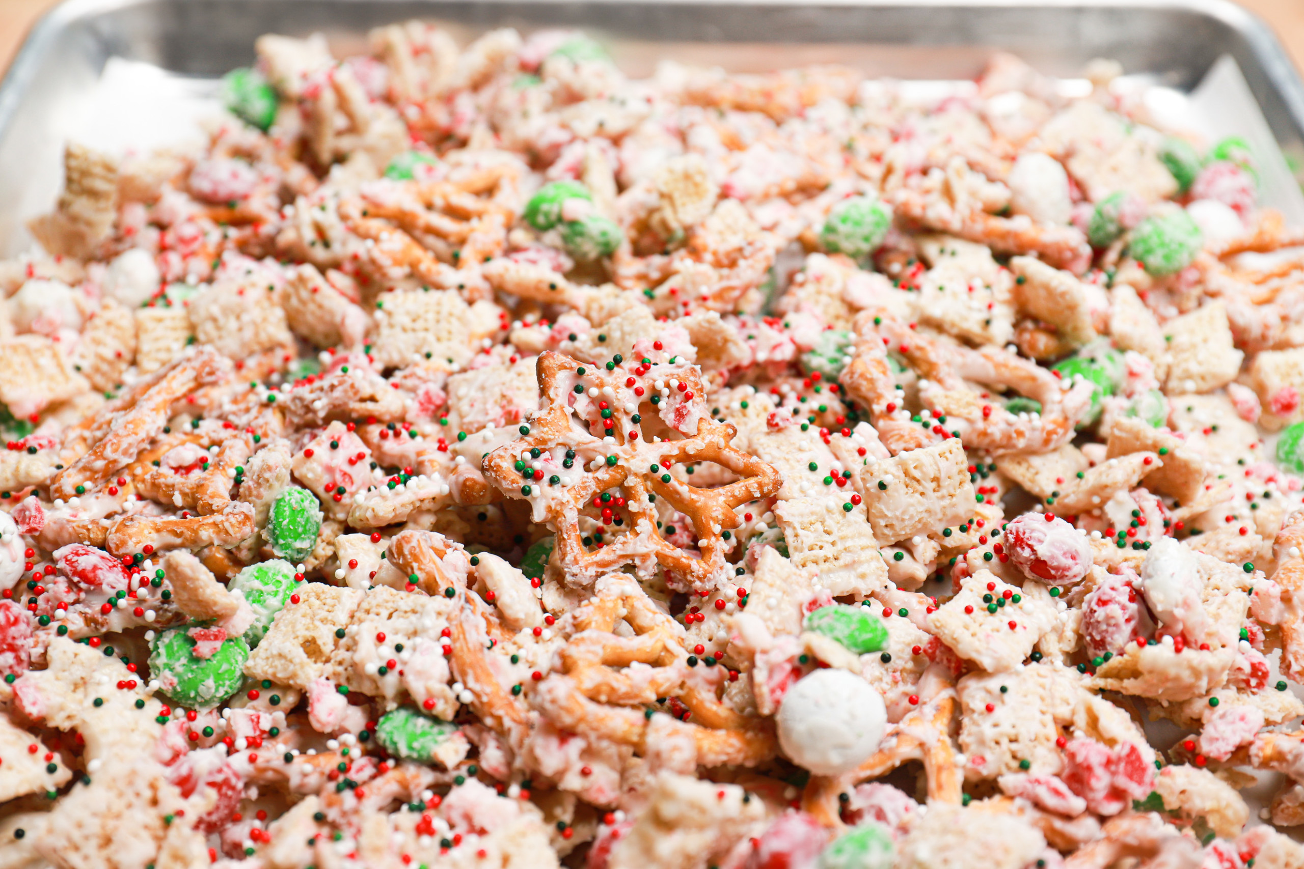 Peppermint crunch snack mix on a baking sheet.