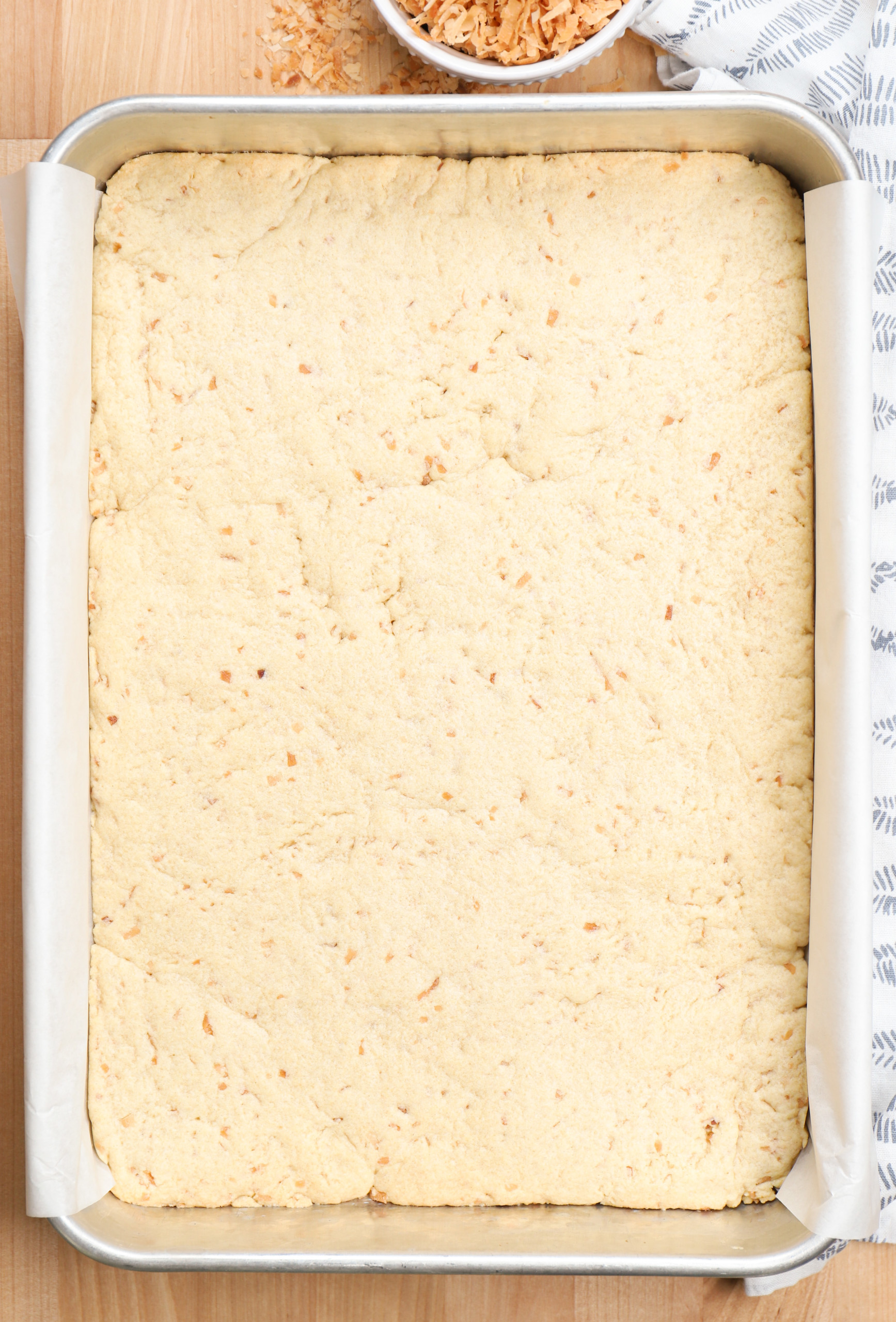 Overhead view of a batch of coconut sugar cookie bars before they are frosted.