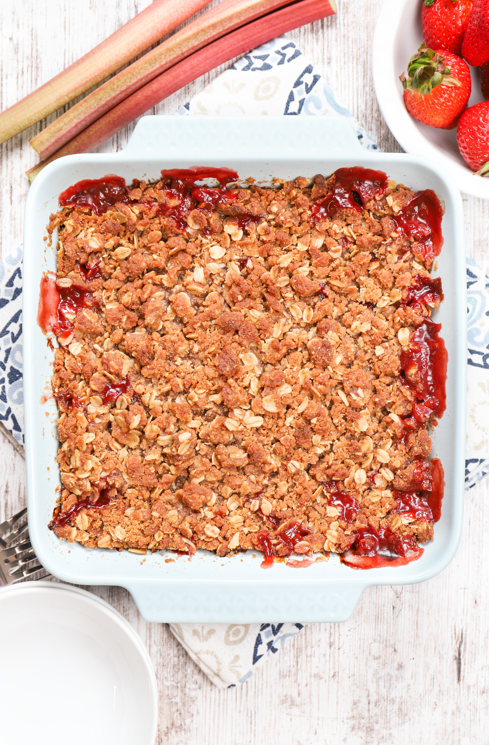 Overhead view of a dish of strawberry rhubarb crisp right out of the oven.