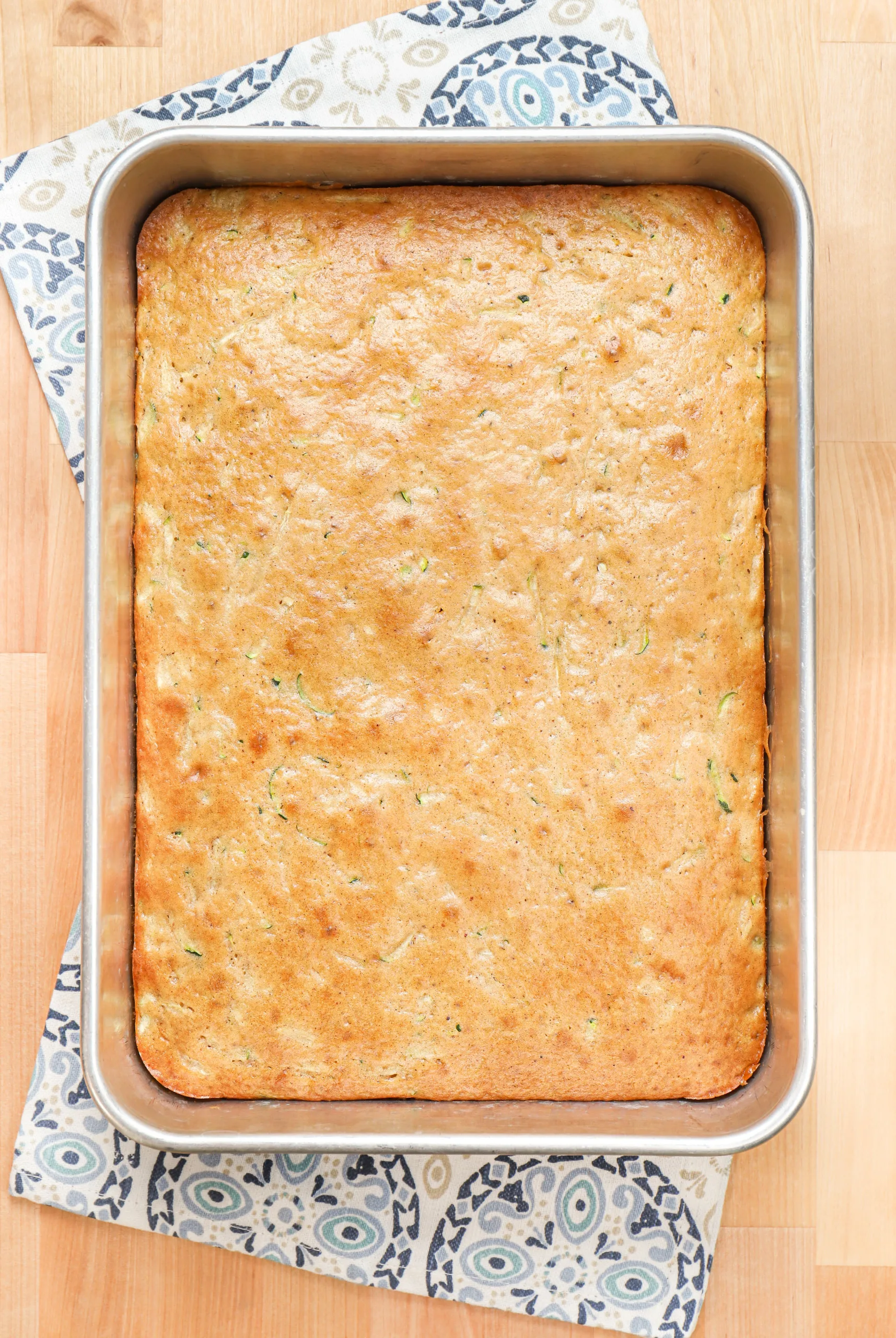 Overhead view of a pan of zucchini bars before being frosted with cream cheese frosting.